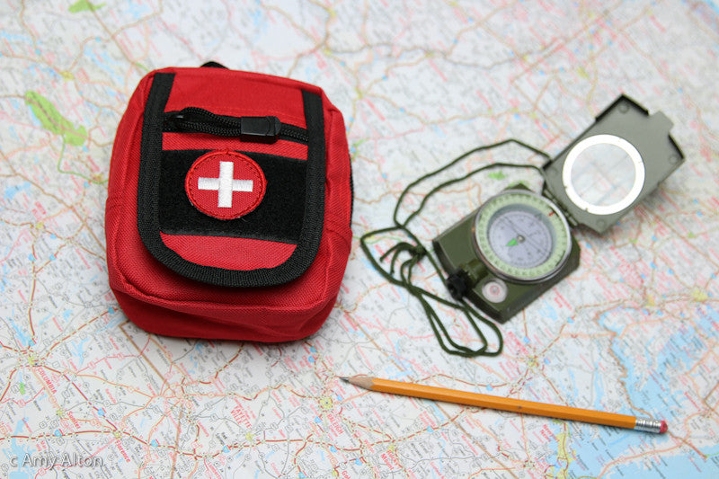 Super easy to carry Ultimate Pocket GRAB N GO™ FIRST AID KIT when traveling locally, remotely or abroad,